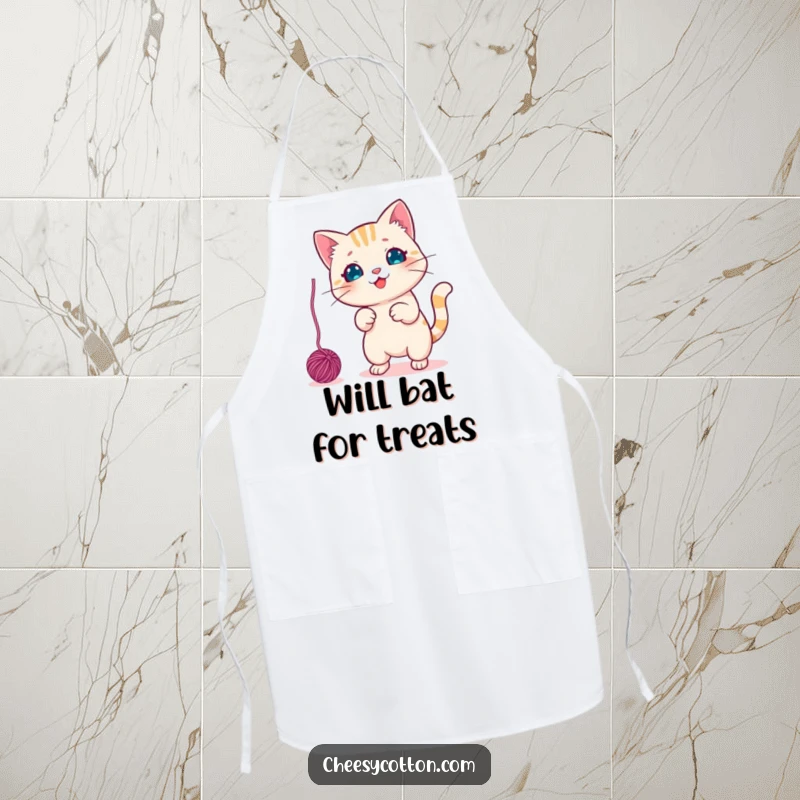 Funny Apron showcasing a cute kawaii cat character playfully swatting a dangling yarn ball, ready for fun in the kitchen.