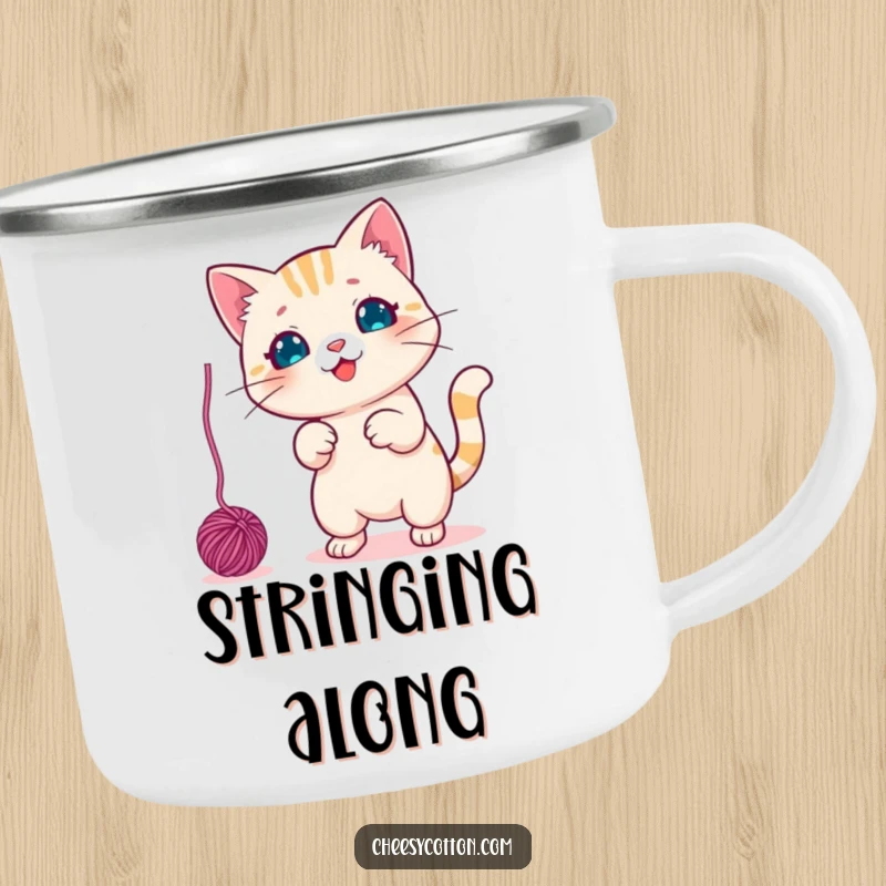Funny Camping Mug with a cute kawaii cat character playfully swatting a dangling yarn ball, ready for outdoor fun.