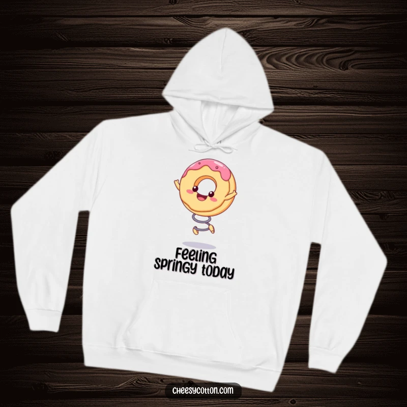 Funny Hoodie with a cute kawaii donut character excitedly bouncing on a spring, designed for maximum coziness and fun.