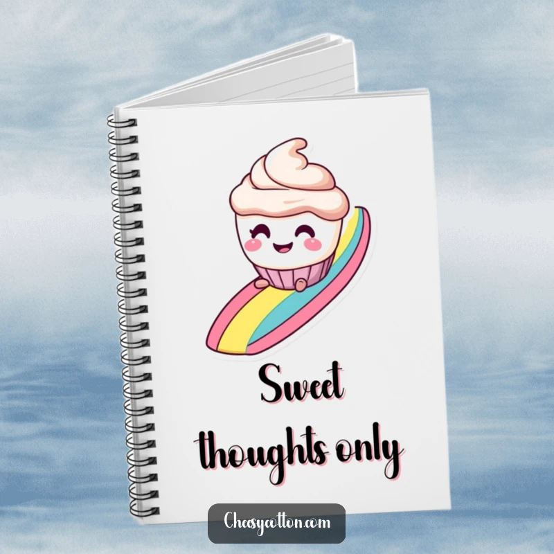 Funny notebook with a smiling cupcake character with mischievous eyes, sliding down a rainbow, perfect for sweet notes.