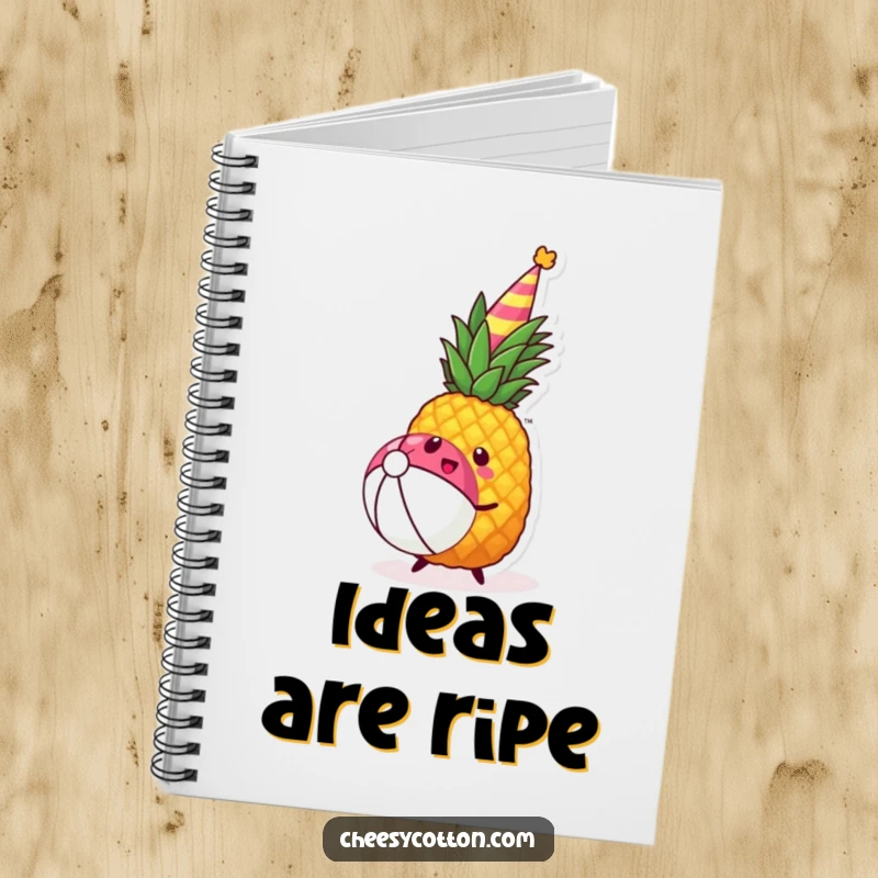 Funny kawaii pineapple wearing a party hat joyfully bouncing a beach ball on a notebook cover.