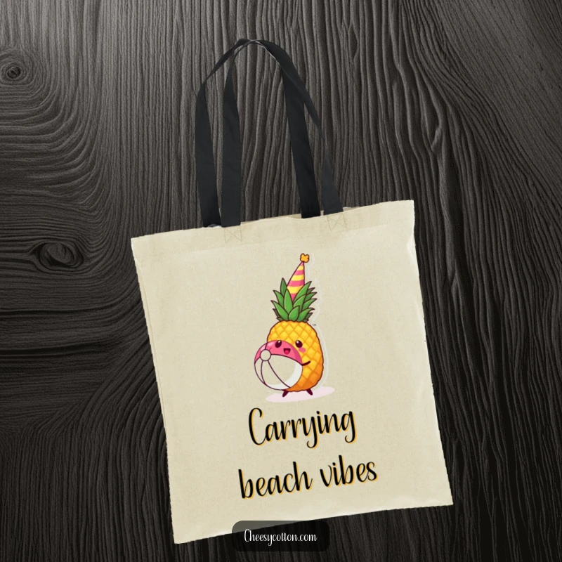 Funny kawaii pineapple wearing a party hat joyfully bouncing a beach ball on a durable tote bag.