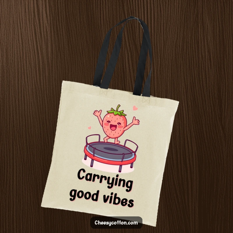Funny strawberry character enjoying a trampoline bounce, designed on a durable tote bag for a humorous and practical accessory.