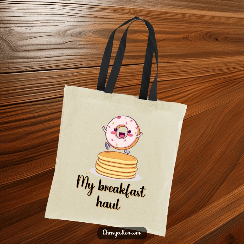 Funny Donut Pancake Leap Tote Bag: A fun tote featuring a determined donut character leaping over a stack of pancakes.